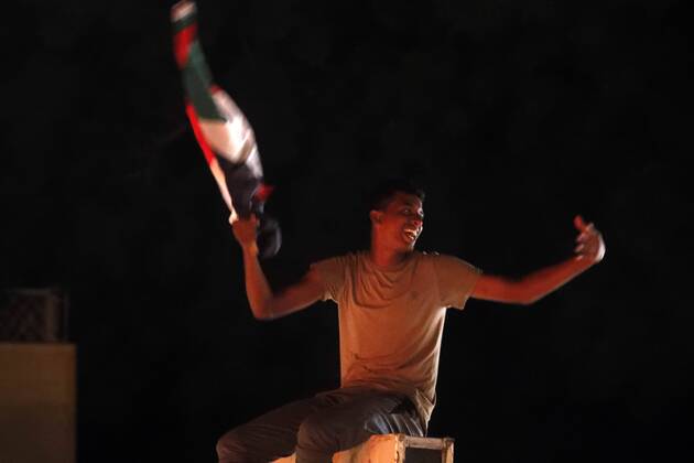(190817) -- KHARTOUM, Aug. 17, 2019 -- A Sudanese waves a national flag to celebrate the official signing of the political and constitutional declarations between the Transitional Military Council and the opposition Freedom and Change Alliance in Khartoum, Sudan, on Aug. 17, 2019, Sudan s Transitional Military Council (TMC) and the opposition Freedom and Change Alliance on Saturday officially signed the political and constitutional declarations to mark beginning of the transitional rule in Sudan. ) SUDAN-KHARTOUM-TRANSITIONAL PERIOD DOCUMENTS-SIGNING-CELEBRATION MohamedxKhidir
