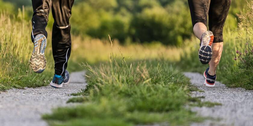Creative Highlights Symbolfoto Legs of man and woman jogging model released Symbolfoto  STSF02057