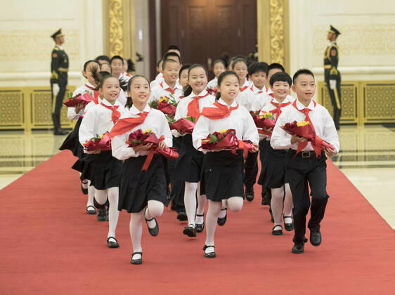 (190929) -- BEIJING, Sept. 29, 2019 -- Children, who are members of Chinese Young Pioneers, present flowers to the awardees of national medals and honorary titles during the presentation ceremony in the Great Hall of the People in Beijing, capital of China, Sept. 29, 2019. China held the presentation ceremony of the national medals and honorary titles on Sunday at the Great Hall of the People, ahead of the 70th anniversary of the founding of the People s Republic of China (PRC) on Oct. 1. ) CHINA-BEIJING-NATIONAL MEDALS-HONORARY TITLES-PRC FOUNDING-70TH ANNIVERSARY (CN) WangxYe 