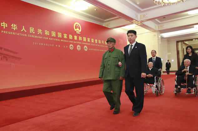(190929) -- BEIJING, Sept. 29, 2019 -- Awardees of the Medal of the Republic Li Yannian, Zhang Fuqing and Huang Xuhua prepare to enter the Golden Hall at the Great Hall of the People in Beijing, capital of China, Sept. 29, 2019. China held the presentation ceremony of the national medals and honorary titles on Sunday at the Great Hall of the People, ahead of the 70th anniversary of the founding of the People s Republic of China (PRC) on Oct. 1. ) CHINA-BEIJING-NATIONAL MEDALS-HONORARY TITLES-PRC FOUNDING-70TH ANNIVERSARY (CN) PangxXinglei 