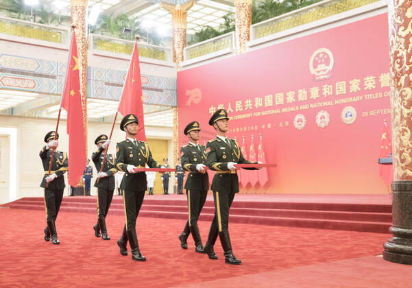 (190929) -- BEIJING, Sept. 29, 2019 -- Guards of honor escort the Medal of the Republic, the Friendship Medal and the Medal for recipients of national honorary titles during the presentation ceremony at the Great Hall of the People in Beijing, capital of China, Sept. 29, 2019. China held the presentation ceremony of the national medals and honorary titles on Sunday at the Great Hall of the People, ahead of the 70th anniversary of the founding of the People s Republic of China (PRC) on Oct. 1. ) CHINA-BEIJING-NATIONAL MEDALS-HONORARY TITLES-PRC FOUNDING-70TH ANNIVERSARY (CN) DingxHaitao 