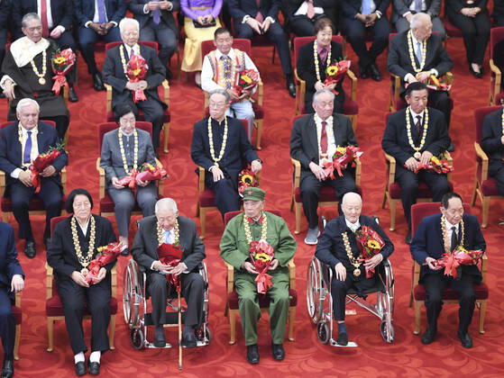 (190929) -- BEIJING, Sept. 29, 2019 -- Awardees of national medals and honorary titles attend the presentation ceremony at the Great Hall of the People in Beijing, capital of China, Sept. 29, 2019. China held the presentation ceremony of the national medals and honorary titles on Sunday at the Great Hall of the People, ahead of the 70th anniversary of the founding of the People s Republic of China (PRC) on Oct. 1. ) CHINA-BEIJING-NATIONAL MEDALS-HONORARY TITLES-PRC FOUNDING-70TH ANNIVERSARY (CN) YinxBogu 