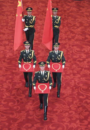 (190929) -- BEIJING, Sept. 29, 2019 -- Guards of honor escort the Medal of the Republic, the Friendship Medal and the Medal for recipients of national honorary titles during the presentation ceremony at the Great Hall of the People in Beijing, capital of China, Sept. 29, 2019. China held the presentation ceremony of the national medals and honorary titles on Sunday at the Great Hall of the People, ahead of the 70th anniversary of the founding of the People s Republic of China (PRC) on Oct. 1. ) CHINA-BEIJING-NATIONAL MEDALS-HONORARY TITLES-PRC FOUNDING-70TH ANNIVERSARY (CN) YinxBogu 