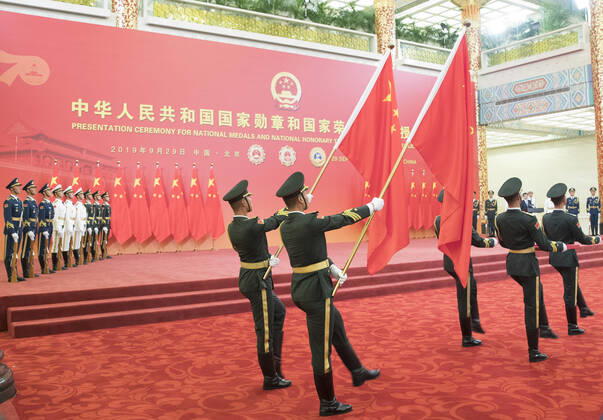 (190929) -- BEIJING, Sept. 29, 2019 -- Guards of honor escort the Medal of the Republic, the Friendship Medal and the Medal for recipients of national honorary titles during the presentation ceremony in the Great Hall of the People in Beijing, capital of China, Sept. 29, 2019. China held the presentation ceremony for national medals and national honorary titles on Sunday at the Great Hall of the People, ahead of the 70th anniversary of the founding of the People s Republic of China (PRC) on Oct. 1. ) CHINA-BEIJING-NATIONAL MEDALS-HONORARY TITLES-PRC FOUNDING-70TH ANNIVERSARY (CN) WangxYe 