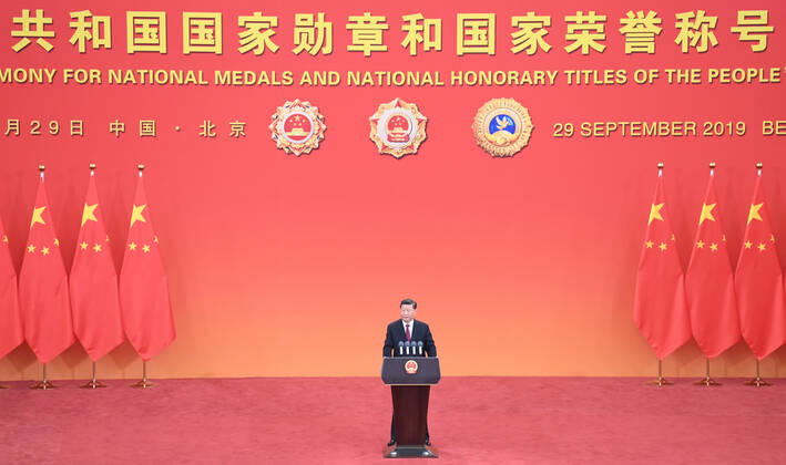 (190929) -- BEIJING, Sept. 29, 2019 -- Chinese President Xi Jinping, also general secretary of the Communist Party of China Central Committee and chairman of the Central Military Commission, delivers a speech at the presentation ceremony of the national medals and honorary titles of the People s Republic of China at the Great Hall of the People in Beijing, capital of China, Sept. 29, 2019. Xi presented the medals to the awardees before the speech. ) CHINA-BEIJING-NATIONAL MEDALS AND HONORARY TITLES-PRESENTATION CEREMONY (CN) YinxBogu 