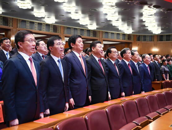 (190929) -- BEIJING, Sept. 29, 2019 -- Xi Jinping, Li Keqiang, Li Zhanshu, Wang Yang, Wang Huning, Zhao Leji, Han Zheng and Wang Qishan join over 4,000 people to watch a high-profile art performance, named Stride Forward, the Nation, at the Great Hall of the People in Beijing, capital of China, Sept. 29, 2019. The performance was held here on Sunday evening in celebration of the 70th founding anniversary of the People s Republic of China. ) CHINA-BEIJING-ART PERFORMANCE-70TH FOUNDING ANNIVERSARY-PRC (CN) XiexHuanchi