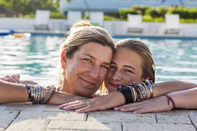 mother and her 13 year old daughter in pool smiling mother and her 13 year old daughter in pool smiling  58787