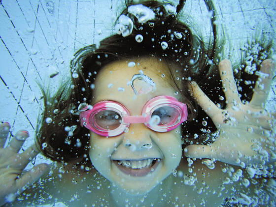 Underwater portrait of a happy girl model released Symbolfoto  XCF00256