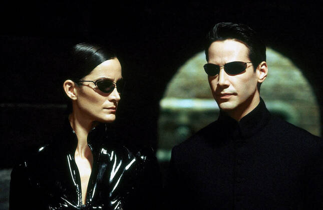 Carrie-Anne Moss & Keanu Reeves Characters: Trinity & Neo Film: The Matrix Reloaded (USA AUS 2003) Director: Andy Wachowski, L. Wachowski 07 May 2003  Copyright: MaryxEvansxAFxArchivexWarnerxBros. 12630911 editorial use only