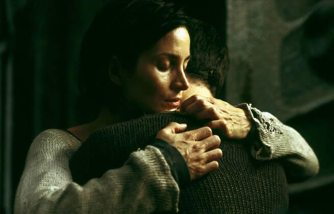Carrie-Anne Moss & Keanu Reeves Characters: Trinity & Neo Film: The Matrix Revolutions (USA AUS 2003) Director: Andy Wachowski, L. Wachowski 27 October 2003  Copyright: MaryxEvansxAFxArchivexWarnerxBros. 12631034 editorial use only