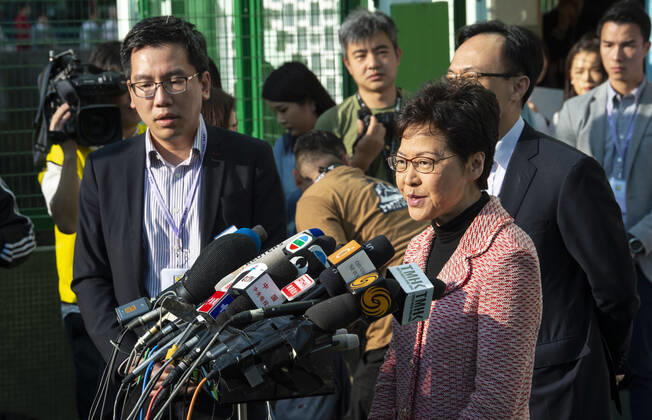 November 24, 2019, Hong Kong, Hong Kong SAR, China: Hong Kong Chief Executive, CARRIE LAM, votes in the local council elections. Lam meets the press at Raymond College in Midlevels Central to cast her vote in an election predicted to show Hong Kongers true views following 5 months of protests. Hong Kong China - ZUMAr144 20191124_zap_r144_002 Copyright: xJaynexRussellx
