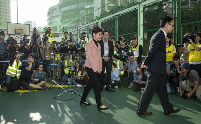 November 24, 2019, Hong Kong, Hong Kong SAR, China: Hong Kong Chief Executive, CARRIE LAM, votes in the local council elections. Lam meets the press at Raymond College in Midlevels Central to cast her vote in an election predicted to show Hong Kongers true views following 5 months of protests. Hong Kong China - ZUMAr144 20191124_zap_r144_008 Copyright: xJaynexRussellx