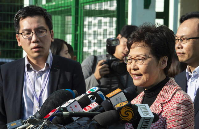 November 24, 2019, Hong Kong, Hong Kong SAR, China: Hong Kong Chief Executive, CARRIE LAM, votes in the local council elections. Lam meets the press at Raymond College in Midlevels Central to cast her vote in an election predicted to show Hong Kongers true views following 5 months of protests. Hong Kong China - ZUMAr144 20191124_zap_r144_017 Copyright: xJaynexRussellx