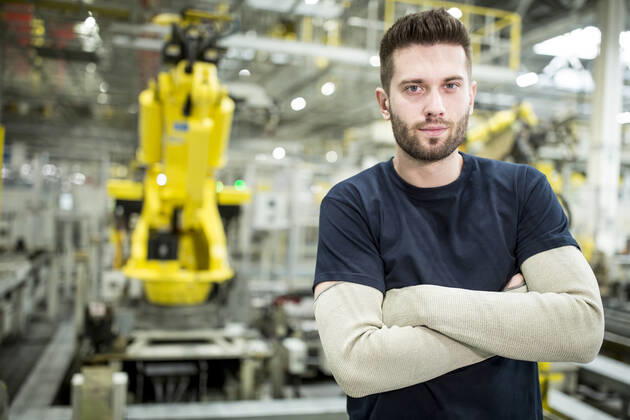 Portrait of confident worker in a modern factory model released Symbolfoto property released WESTF24306