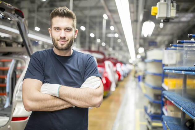Portrait of confident worker in modern car factory model released Symbolfoto property released WESTF24372