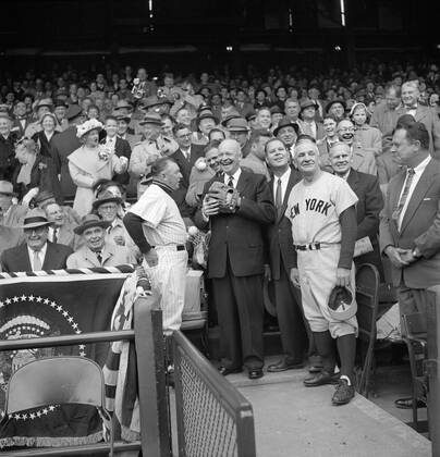 U.S. President Dwight Eisenhower getting ready to Toss out First Ball at Opening Day Baseball Game between Washington Senators and New York Yankees, Yankees Manager Casey Stengel to right, Senators Manager Chuck Dressen to left, Washington, D.C., USA, photograph by Warren K. Leffler, April 17, 1956  Copyright: xCircaxImagesx ghi-circa07646