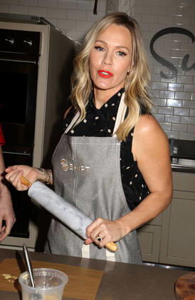 December 10, 2019, New York, New York, USA: Actress JENNIE GARTH from Beverly Hills 90210 holds a rolling pin at the partnership launch of Shipt, a grocery delivery service and kitchenware retailer Sur La Table. New York USA - ZUMAk03_ 20191210_zaf_k03_098 Copyright: xNancyxKaszermanx