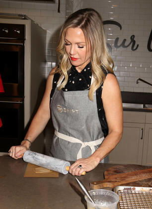 December 10, 2019, New York, New York, USA: Actress JENNIE GARTH from Beverly Hills 90210 uses a rolling pin at the partnership launch of Shipt, a grocery delivery service and kitchenware retailer Sur La Table. New York USA - ZUMAk03_ 20191210_zaf_k03_100 Copyright: xNancyxKaszermanx