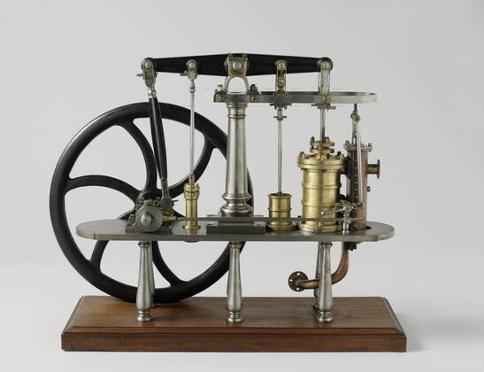 Model of a Double-Acting Beam Engine, Model of a double-acting land-based steam engine, on a wooden ground board. The model has a balance and flywheel, but no condenser. The piston drives the balance, which in turn drives the air pump, the cold water pump of the condenser and the crankshaft. The flywheel is mounted on the crankshaft and on the other side an eccentric with a long drive rod, which drives the steam slide on the other side of the machine. The steam valve has two inputs on the cylinder. The air pump seal is missing. Scale 1:20 (derived)., H.W. Fricke (mentioned on object), 1840, iron (metal), brass (alloy), copper (metal), wood (plant material), paint (coating), h 63 cm x w 75 cm x d 28 cm x w 51.8 kg Copyright Artokoloro LCK_190715_035684