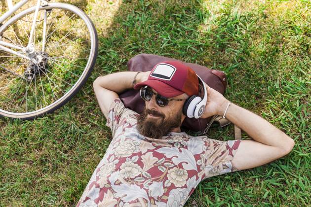 Mature man with red basecap, sunglasses and white headphones model released Symbolfoto  TCF06227