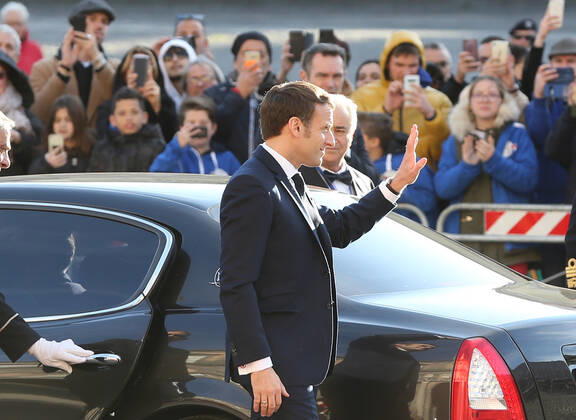 French President Emmanuel Macron waves to people as arriving at the Royal Palace, venue of the XXXV Italian-French Summit Copyright: xCarloxHermannx xIPAx xKontrolabx
