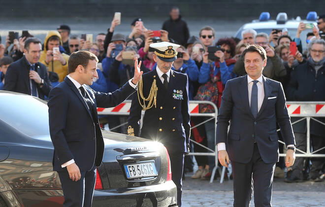 French President Emmanuel Macron waves to people (L) next to Italian Prime Minister Giuseppe Conte as arriving at the Royal Palace, venue of the XXXV Italian-French Summit Copyright: xCarloxHermannx xIPAx xKontrolabx