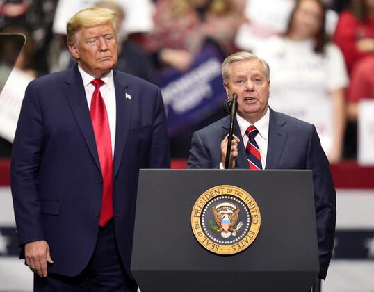 March 2, 2020, Charlotte, North Carolina, USA: United States Senator LINDSEY GRAHAM addresses the crowd as President DONALD TRUMP looks on during a Keep America Great rally at the Bojangles Coliseum in Charlotte, North Carolina on Monday March 2, 2020. 14 states and American Samoa will vote or caucus on Tuesday March 3rd. Their ballots will represent over 33 percent of the national primary totals. Charlotte USA - ZUMAj110 20200302_zsp_j110_037 Copyright: xRustyxJonesx