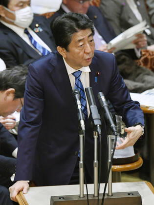 Japan PM Abe Japanese Prime Minister Shinzo Abe attends a House of Councillors Budget Committee session in Tokyo on March 3, 2020.