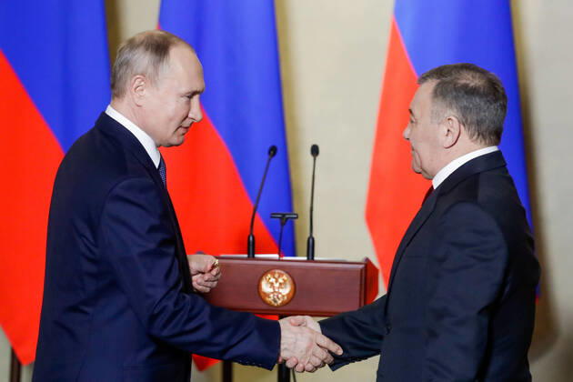 SEVASTOPOL, RUSSIA - MARCH 18, 2020: Russia s President Vladimir Putin (L) awards a Russian Hero of Labour gold star to Stroygazmontazh owner Arkady Rotenberg for the construction of Kerch Strait Bridge, during a ceremony at the Konstantinovskaya Batareya Konstantin Battery Museum and Exhibition Centre. Mikhail Metzel TASS  TS0D2A27