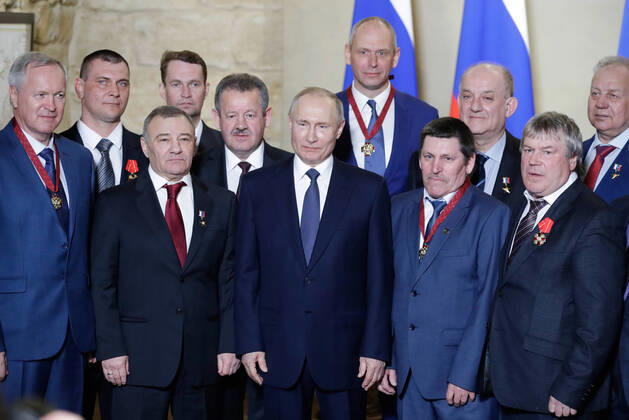 SEVASTOPOL, RUSSIA - MARCH 18, 2020: Russia s President Vladimir Putin (C) poses with participants in a ceremony to present state decorations at the Konstantinovskaya Batareya Konstantin Battery Museum and Exhibition Centre. Mikhail Metzel TASS  TS0D2A2A