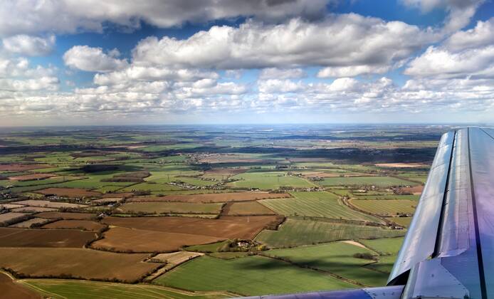 View out of airplane Airplane wing in flight View out of airplane Airplane wing in flight Copyright: xmitakagx 13211884