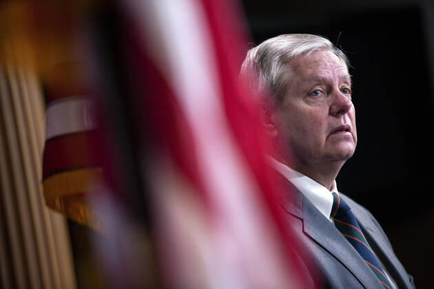 United States Senator Lindsey Graham (Republican of South Carolina) listens during a news conference with United States Senator Tim Scott (Republican of South Carolina), United States Senator Rick Scott (Republican of Florida), and United States Senator Ben Sasse (Republican of Nebraska) at the United States Capitol in Washington D.C., U.S. on Wednesday, March 25, 2020. The Senators are calling for a correction to a supposed drafting error in the Coronavirus Stimulus Package that the Senate was set to vote on today, stating it incentivizes unemployment. Copyright: xStefanixReynoldsx