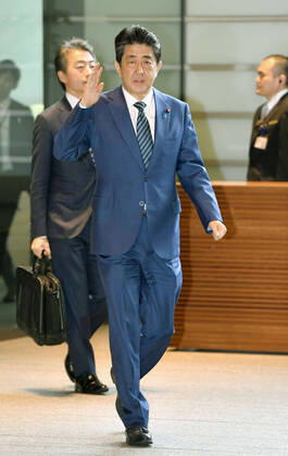 Japan PM Abe Japanese Prime Minister Shinzo Abe arrives at his office in Tokyo on March 31, 2020.