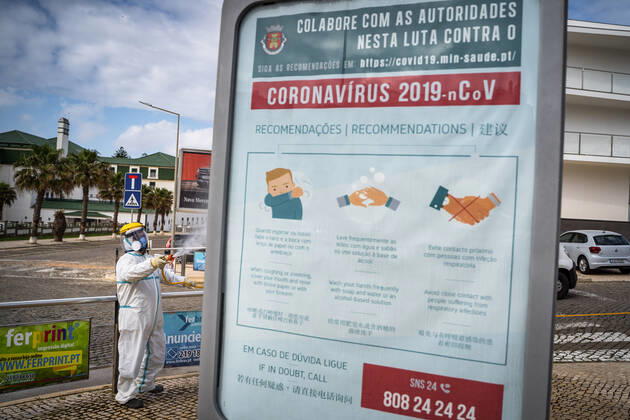 April 14, 2020, Ericeira, Portugal: An employee of the Ericeira parish council, equipped with the recommended protective materials, disinfects the street with a solution based on hypochlorite (bleach)..The municipality of Mafra had 70 cases of COVID-19 pandemic. In order to prevent the spread of the virus, the Ericeira Parish Council perform weekly street disinfection. Ericeira Portugal - ZUMAs197 20200414_zaa_s197_175 Copyright: xHenriquexCasinhasx