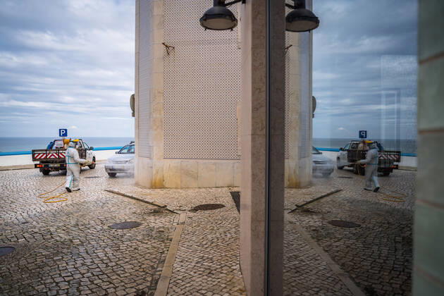 April 14, 2020, Ericeira, Portugal: An employee of the Ericeira parish council, equipped with the recommended protective materials, disinfects the street with a solution based on hypochlorite (bleach)..The municipality of Mafra had 70 cases of COVID-19 pandemic. In order to prevent the spread of the virus, the Ericeira Parish Council perform weekly street disinfection. Ericeira Portugal - ZUMAs197 20200414_zaa_s197_181 Copyright: xHenriquexCasinhasx