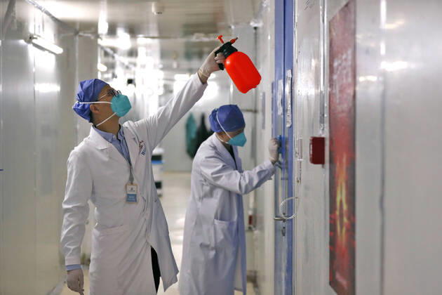 (200415) -- WUHAN, April 15, 2020 -- Medical workers conduct disinfection at Leishenshan (Thunder God Mountain) Hospital in Wuhan, capital of central China s Hubei Province, April 15, 2020. Wuhan Leishenshan (Thunder God Mountain) Hospital ceased operation in Wuhan on Wednesday as the coronavirus epidemic wanes. ) CHINA-HUBEI-WUHAN-LEISHENSHAN HOSPITAL-RETIRING (CN) ShenxBohan 
