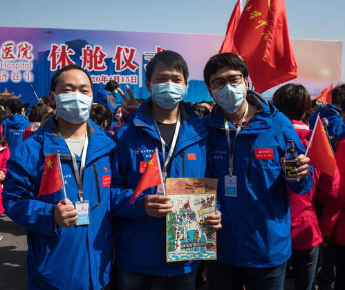 (200415) -- WUHAN, April 15, 2020 -- Medics attend the closing ceremony of Leishenshan (Thunder God Mountain) Hospital in Wuhan, capital of central China s Hubei Province, April 15, 2020. Wuhan Leishenshan (Thunder God Mountain) Hospital ceased operation in Wuhan on Wednesday as the coronavirus epidemic wanes. ) CHINA-HUBEI-WUHAN-LEISHENSHAN HOSPITAL-RETIRING (CN) XiaoxYijiu 