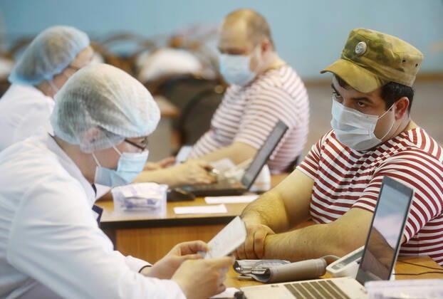 MOSCOW REGION, RUSSIA - APRIL 15, 2020: Servicemen of the extra-departmental security of Russia s Federal National Guard Service (Rosgvardia) have their blood pressure measured before donating blood during a blood donating campaign titled From Heart to Heart in a gym at the Moscow Region Main Directorate of Russia s Federal National Guard Service (Rosgvardia) in the town of Reutov. The campaign is organized by medical brigades of a special medical complex fitted with air disinfection equipment. Sergei Fadeichev TASS  TS0D5CCB