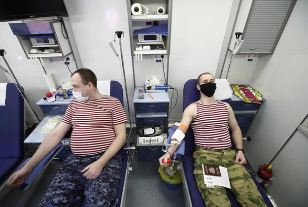 MOSCOW REGION, RUSSIA - APRIL 15, 2020: Servicemen of Russia s Federal National Guard Service (Rosgvardia) donating blood during a blood donating campaign titled From Heart to Heart in a gym at the Moscow Region Main Directorate of Russia s Federal National Guard Service (Rosgvardia) in the town of Reutov. The campaign is organized by medical brigades of a special medical complex fitted with air disinfection equipment. Sergei Fadeichev TASS  TS0D5CEB