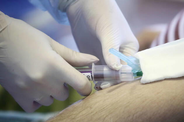 MOSCOW REGION, RUSSIA - APRIL 15, 2020: A serviceman of the extra-departmental security of Russia s Federal National Guard Service (Rosgvardia) donating blood during a blood donating campaign titled From Heart to Heart in a gym at the Moscow Region Main Directorate of Russia s Federal National Guard Service (Rosgvardia) in the town of Reutov. The campaign is organized by medical brigades of a special medical complex fitted with air disinfection equipment. Sergei Fadeichev TASS  TS0D5D25