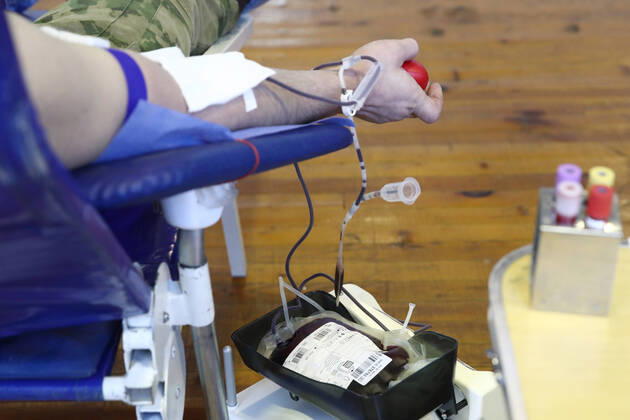 MOSCOW REGION, RUSSIA - APRIL 15, 2020: A serviceman of the extra-departmental security of Russia s Federal National Guard Service (Rosgvardia) donating blood during a blood donating campaign titled From Heart to Heart at the Moscow Region Main Directorate of Russia s Federal National Guard Service (Rosgvardia) in the town of Reutov. The campaign is organized by medical brigades of a special medical complex fitted with air disinfection equipment. Sergei Fadeichev TASS  TS0D5D3A