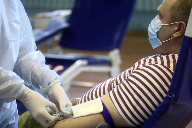 MOSCOW REGION, RUSSIA - APRIL 15, 2020: A serviceman of the extra-departmental security of Russia s Federal National Guard Service (Rosgvardia) donating blood during a blood donating campaign titled From Heart to Heart at the Moscow Region Main Directorate of Russia s Federal National Guard Service (Rosgvardia) in the town of Reutov. The campaign is organized by medical brigades of a special medical complex fitted with air disinfection equipment. Sergei Fadeichev TASS  TS0D5D3D