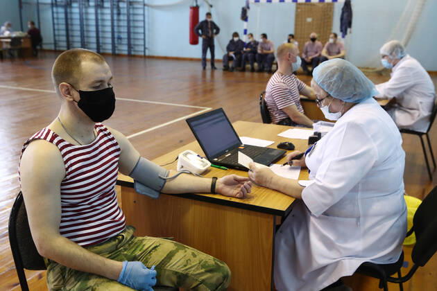 MOSCOW REGION, RUSSIA - APRIL 15, 2020: Servicemen of the extra-departmental security of Russia s Federal National Guard Service (Rosgvardia) before donating blood during a blood donating campaign titled From Heart to Heart at the Moscow Region Main Directorate of Russia s Federal National Guard Service (Rosgvardia) in the town of Reutov. The campaign is organized by medical brigades of a special medical complex fitted with air disinfection equipment. Sergei Fadeichev TASS  TS0D5D3F