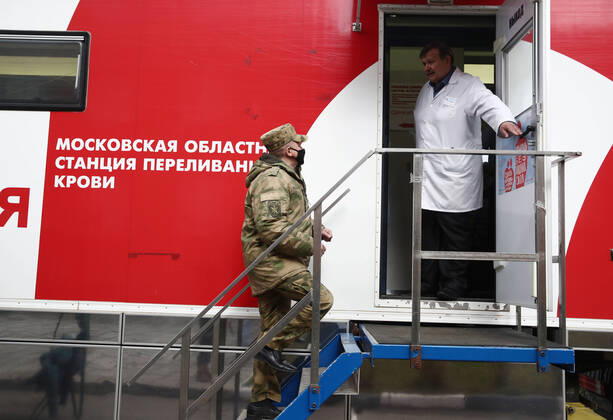 MOSCOW REGION, RUSSIA - APRIL 15, 2020: A serviceman of the extra-departmental security of Russia s Federal National Guard Service (Rosgvardia) before donating blood during a blood donating campaign titled From Heart to Heart at the Moscow Region Main Directorate of Russia s Federal National Guard Service (Rosgvardia) in the town of Reutov. The campaign is organized by medical brigades of a special medical complex fitted with air disinfection equipment. Sergei Fadeichev TASS  TS0D5D47