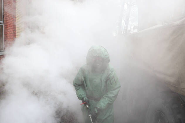 April 15, 2020, Saint-Petersburg, Russia: Russian soldier wearing a protective suit disinfects a train factory area to prevent the spread of coronavirus (COVID-19)..Russia has recorded at least 24490 cases and 198 deaths by the COVID-19 disease. Saint-Petersburg Russia - ZUMAs197 20200415_zaa_s197_017 Copyright: xSergeixMikhailichenkox