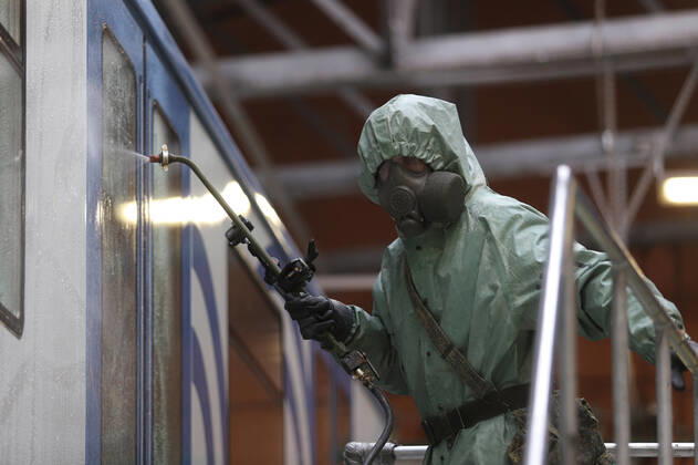 April 15, 2020, Saint-Petersburg, Russia: Russian soldier wearing a protective suit disinfects a train factory area to prevent the spread of coronavirus (COVID-19)..Russia has recorded at least 24490 cases and 198 deaths by the COVID-19 disease. Saint-Petersburg Russia - ZUMAs197 20200415_zaa_s197_022 Copyright: xSergeixMikhailichenkox