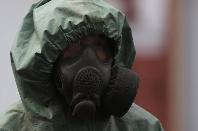 April 15, 2020, Saint-Petersburg, Russia: Russian soldier wearing a protective suit disinfects a train factory area to prevent the spread of coronavirus (COVID-19)..Russia has recorded at least 24490 cases and 198 deaths by the COVID-19 disease. Saint-Petersburg Russia - ZUMAs197 20200415_zaa_s197_024 Copyright: xSergeixMikhailichenkox