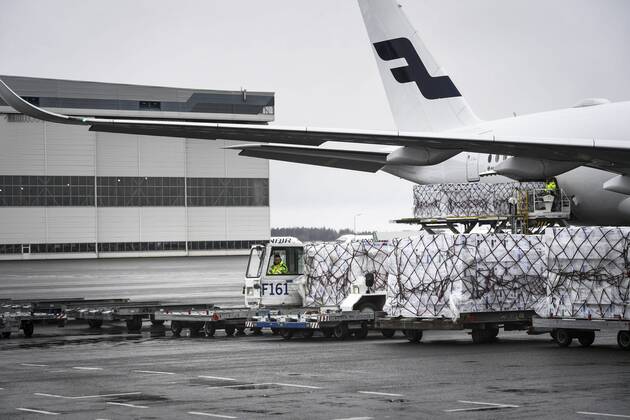 Workers unload a Finnair cargo plane which arrived from China with medical equipment needed against the novel coronavirus at the Helsinki-Vantaa Airport in Vantaa, Finland on April 15, 2020. Vantaa Finland  Copyright: xEmmixKorhonenx LKKTH20200415142451GLPN