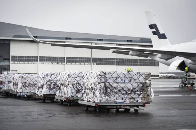 Workers unload a Finnair cargo plane which arrived from China with medical equipment needed against the novel coronavirus at the Helsinki-Vantaa Airport in Vantaa, Finland on April 15, 2020. Vantaa Finland  Copyright: xEmmixKorhonenx LKKTH20200415142530AXDC