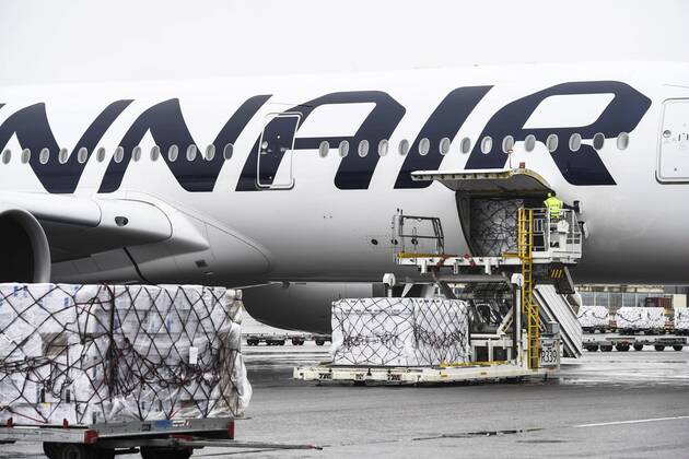 Workers unload a Finnair cargo plane which arrived from China with medical equipment needed against the novel coronavirus at the Helsinki-Vantaa Airport in Vantaa, Finland on April 15, 2020. Vantaa Finland  Copyright: xEmmixKorhonenx LKKTH20200415142903BKDU